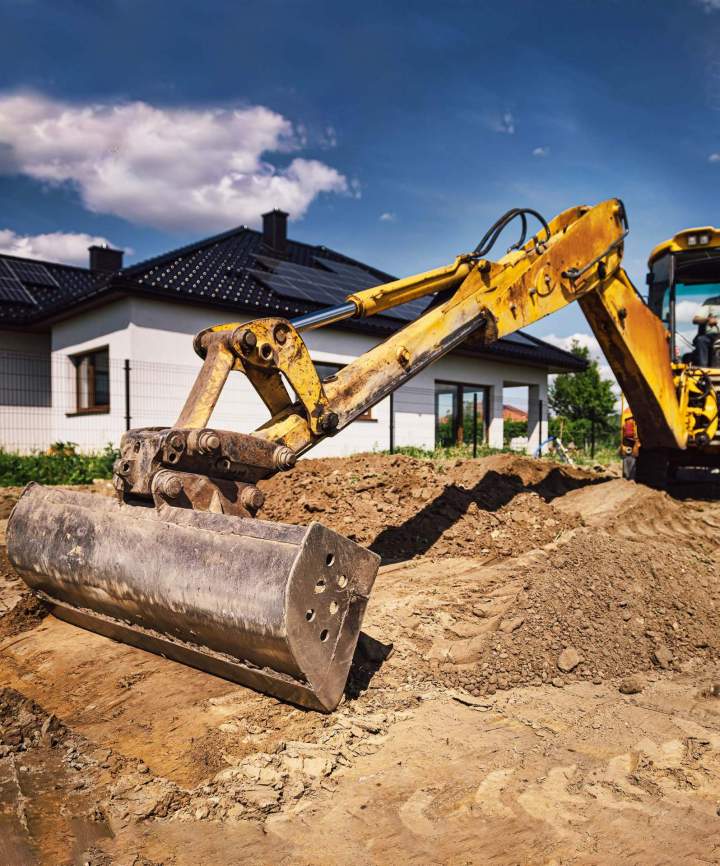 Excavation equipment preparing foundation site