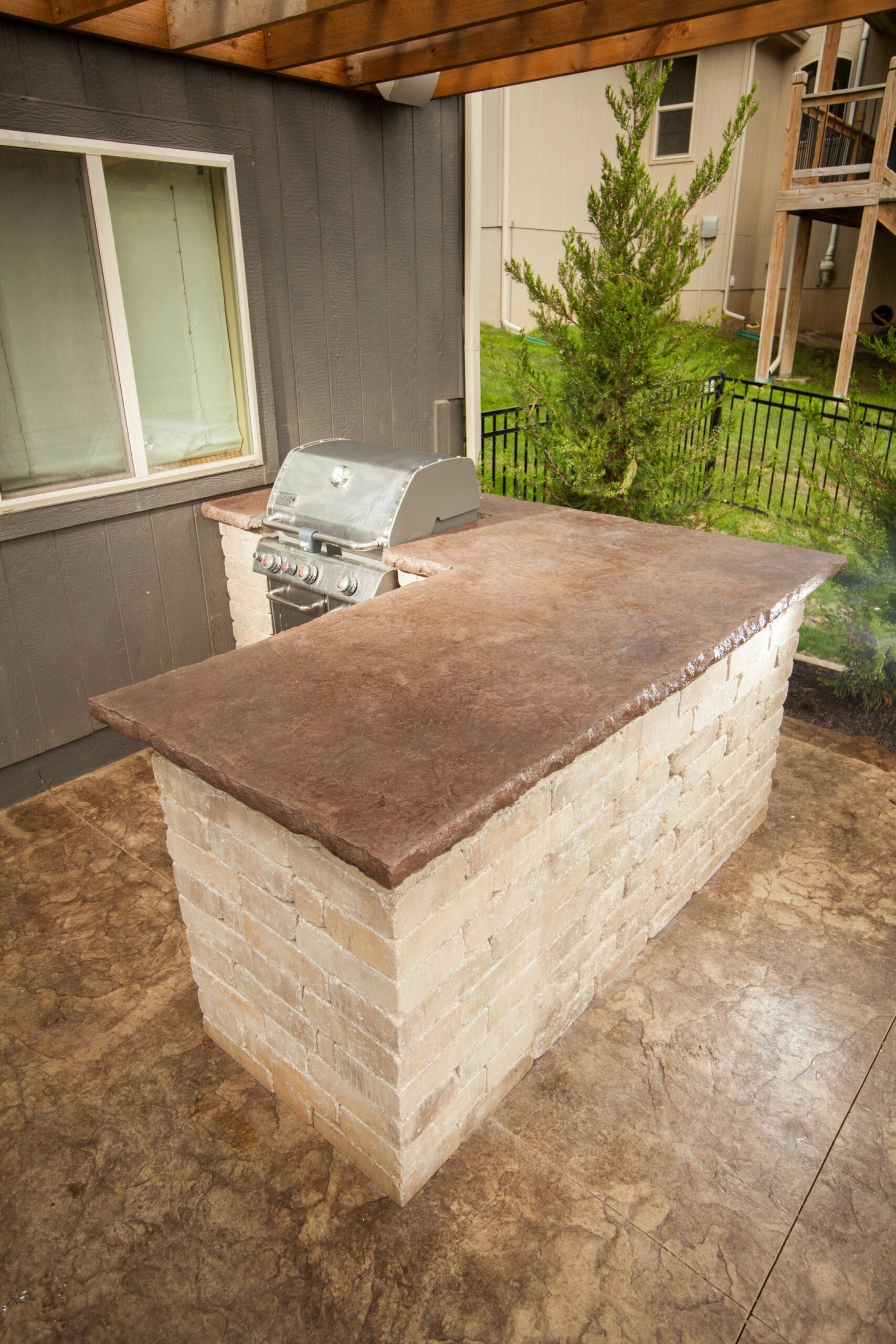 Paver patio with outdoor kitchen and fire pit