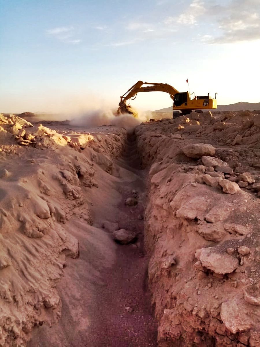 Rock breaking excavator on rocky terrain