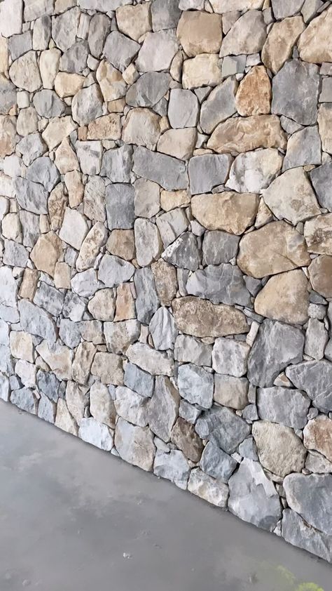 Finished custom stone wall in landscape